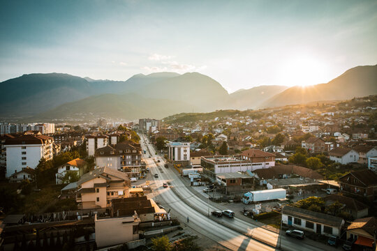 Sun setting over city of Pej&euml;, Kosovo
