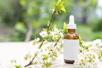 Top view of mockup of white squeeze bottle tube. small white flowers. medicine or cosmetics - cream, gel, skin care, toothpaste.