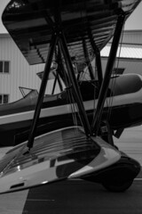Vertical grayscale image of a modern biplane with a beautiful design