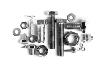 Different metal bolts and nuts on white background, top view