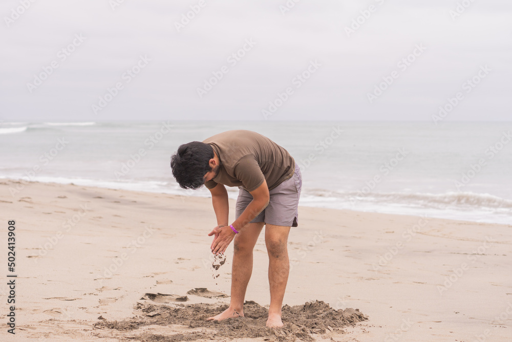 Canvas Prints Young Hispanic man practicing various poses in yoga on the beach