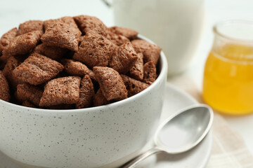 Bowl of sweet crispy chocolate corn pads on table, closeup