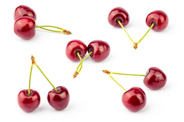 Cherry isolated on white background. Fresh cherries pattern with stems. Cherry set.