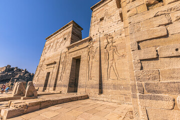Aswan, Egypt -  November 15, 2021: Ancient temple of Philae in the outskirts of the city of Aswan, Egypt - obrazy, fototapety, plakaty