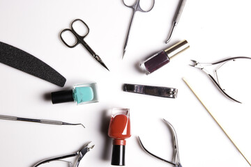 Closeup of nail care products on a gray surface