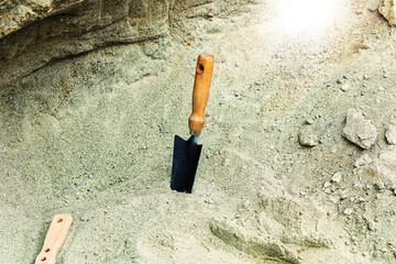 Shovel in the sand.Skeleton and archaeological tools.Digging for fossils.