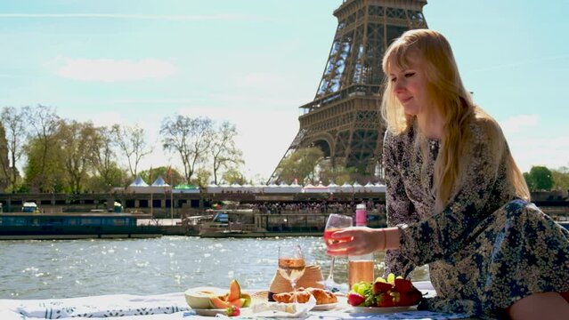 Woman in paris picnic with wine. Selective focus.
