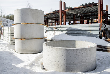 Reinforced concrete rings of the walls of wells.