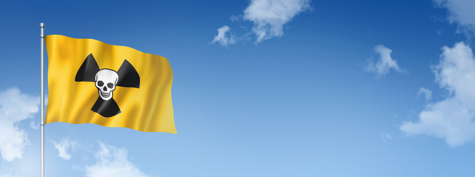 radioactive nuclear symbol death flag isolated on a blue sky. Horizontal banner