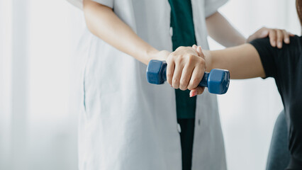 Physiotherapist is doing physical therapy for a patient, the patient has body aches due to overwork and has undergone treatment and physiotherapy with a professional physiotherapist.