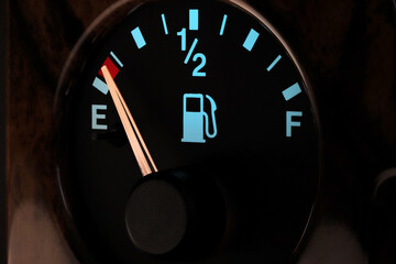 Naklejka premium fuel gauge in car dashboard in illuminated night mode - empty