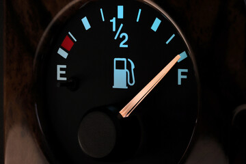 fuel gauge in car dashboard in illuminated night mode  - full