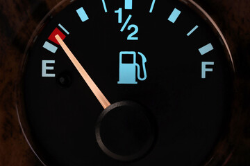 fuel gauge in car dashboard in illuminated night mode  - empty