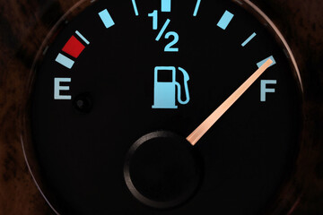 fuel gauge in car dashboard in illuminated night mode  - full