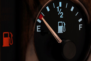 fuel gauge in car dashboard in illuminated night mode  - empty