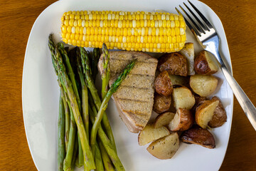 tuna  steak  with asparagus and corn