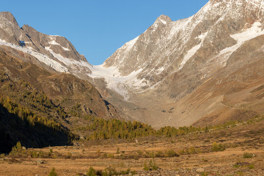 Glacier coming through Valley at sunset light.