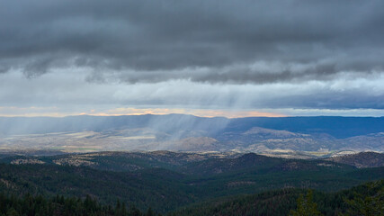 Rainy clouds above the mountain forest in Eastern Oregon.