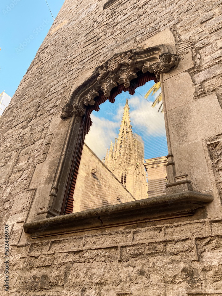 Wall mural Vertical shot of a window of The Cathedral of the Holy Cross and Saint Eulalia