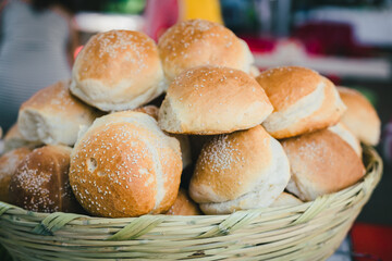 Cemita poblana bread in a wicker basket at a market