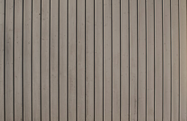 a wall of gray varnished wooden planks