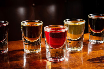 alcoholic drinks in shot glasses