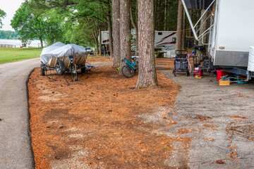 Family vacation RV camping on the lake in Tennessee with a boat, golf cart and bicycles.
