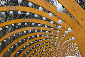 wooden arch with lights in the park
