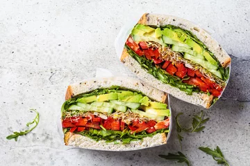 Foto auf Acrylglas Vegetable sandwich in paper wrap. Vegan healthy food, takeaway food. © vaaseenaa