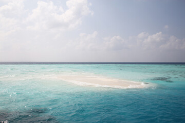 Maldives. Small island in the Indian Ocean. Blue sky and clean turquoise water.