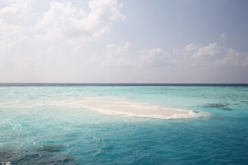 Maldives. Small island in the Indian Ocean. Blue sky and clean turquoise water.