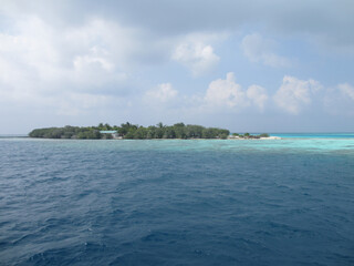 Maldives. Small island in the Indian Ocean. Blue sky and clean turquoise water.
