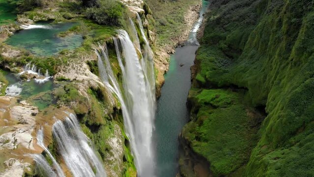 Aerial view of Beautiful Fascinating Tamul Waterfall with turquoise water in San Luis Potosi, Mexico