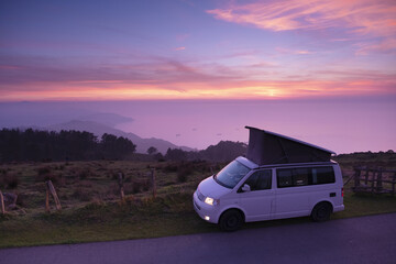 Van at sunset over the sea on mount Jaizkibel, Euskadi