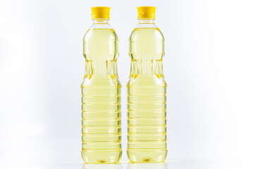 a bottle of vegetable oil on a white background,Oil in plastic bottles. Two bottles isolated on white background. With clipping path