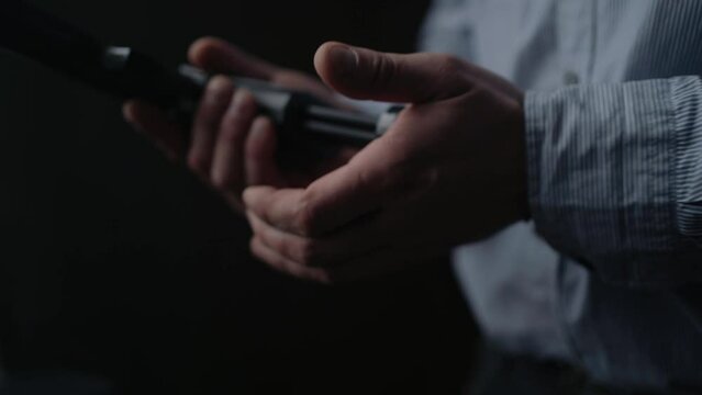 Close up, Special secret agent takes pistol gun. Spying or intelligence gathering. Espionage concept. Weapon legalization.