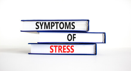 Symptoms of stress symbol. Concept words Symptoms of stress on books. Beautiful white table white background. Psychological business and Symptoms of stress concept. Copy space.