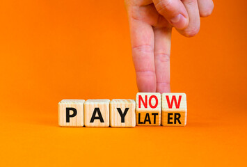 Pay later or now symbol. Businessman turns wooden cubes and changes concept words Pay later to Pay now. Beautiful orange table orange background. Business pay later or now concept. Copy space.