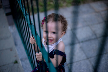 Baby portrait smiling at the gate