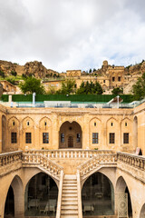 Mardin old town architecture and view with Mardin castle at the top.  The historical old post office building in ancient city of Mardin, Turkey