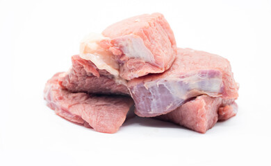 fresh Pile of beef cubes isolated on white.