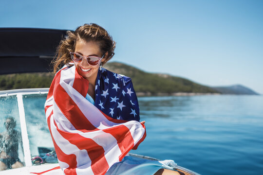 Woman Wrapped In US National Flag Spending Day On Private Yacht