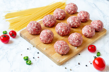 Mincemeat, uncooked Meatball on a table