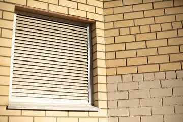 Ventilation grille in wall. Details of building. White steel grille for heat and odor removal.