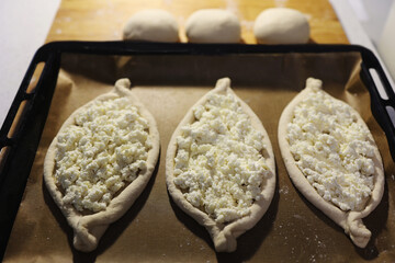 Khachapuri in Adjarian. Open pie with mozzarella and egg. Traditional Georgian cuisine