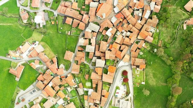 Aerial landscape with alpine village houses. Video of the small town of Pasturo in Lombardy, North Italy showing cottages from above. Footage 4k, drone view