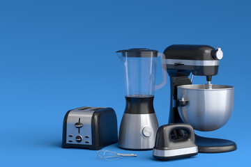 Electric blender for making healthy smoothie, hand mixer and toaster on blue