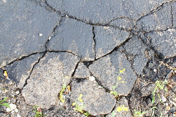 Obraz premium cracked and damaged parking lot,road or driveway need for repairing 
