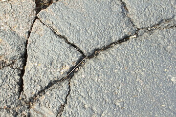cracked and damaged parking lot,road or driveway need for repairing 