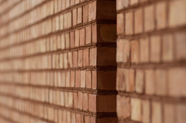 Fragment of a Brick wall - wall from red bricks - background, close-up